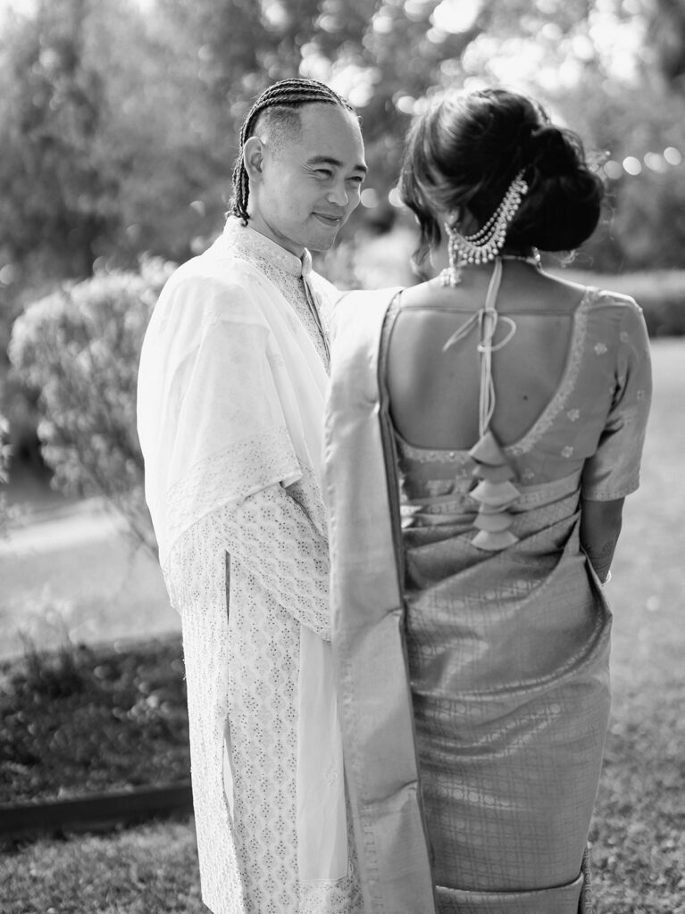 South Asian Bride and Groom looking at each other styles. Bridal Styling by Pattupleats